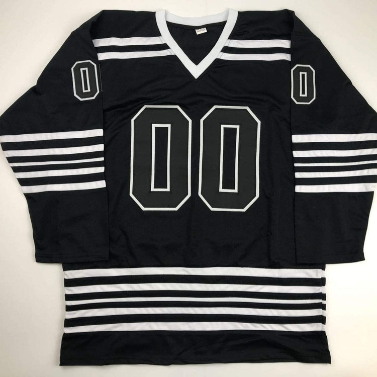 Autographed/Signed Chevy Chase Clark Griswold Christmas Vacation Movie Chicago Black Hockey Jersey Beckett BAS COA