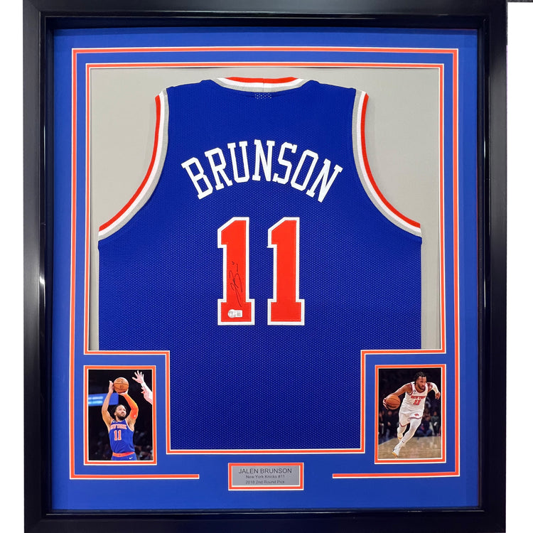Framed Autographed/Signed Jalen Brunson 35x39 New York Blue Basketball Jersey Beckett BAS COA