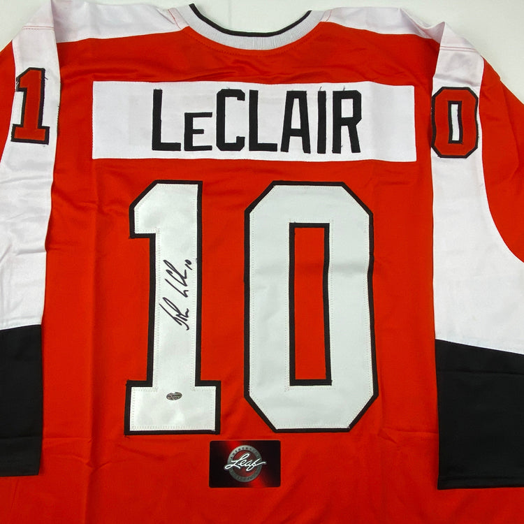 Autographed/Signed John LeClair Philadelphia Orange Hockey Jersey Leaf Authentics COA