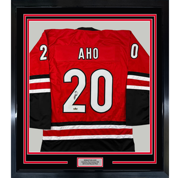 Framed Facsimile Autographed Sebastian Aho 35x39 Carolina Red Reprint Laser Auto Hockey Jersey