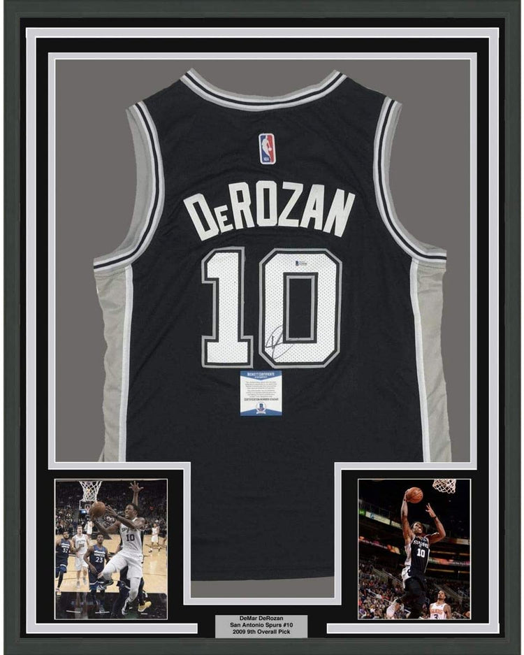 Framed Autographed/Signed DeMar DeRozan 35x39 San Antonio Black Basketball Jersey Beckett BAS COA