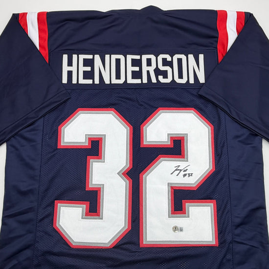 Autographed/Signed TreVeyon Henderson New England Blue Football Jersey Beckett BAS COA
