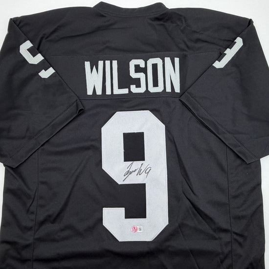 Autographed/Signed Tyree Wilson Oakland Las Vegas Black Football Jersey Beckett BAS COA