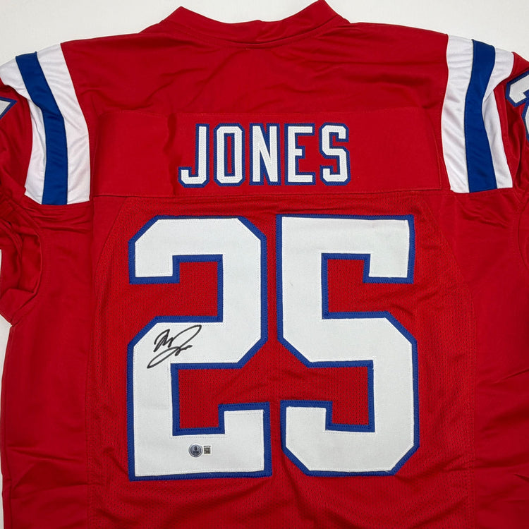 Autographed/Signed Marcus Jones New England Red Pro Cut Football Jersey Beckett BAS COA