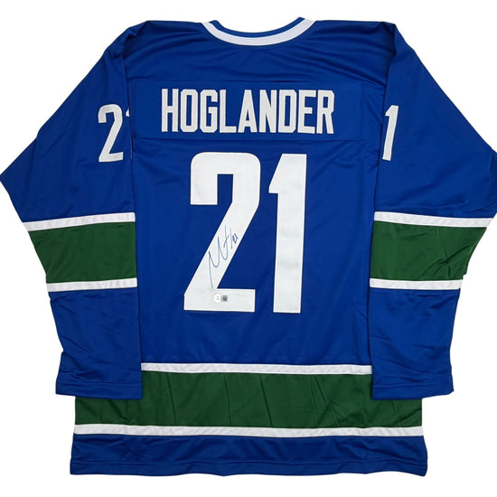 Autographed/Signed Nils Hoglander Vancouver Blue Hockey Jersey Beckett BAS COA
