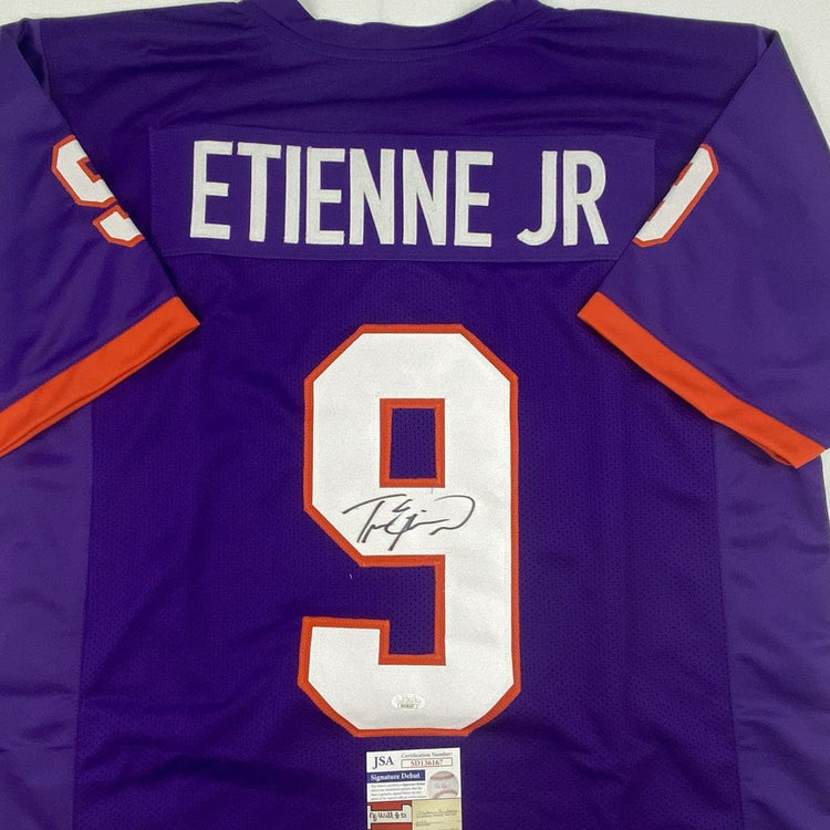 Autographed/Signed Travis Etienne Jr. Clemson Purple College Football Jersey JSA COA