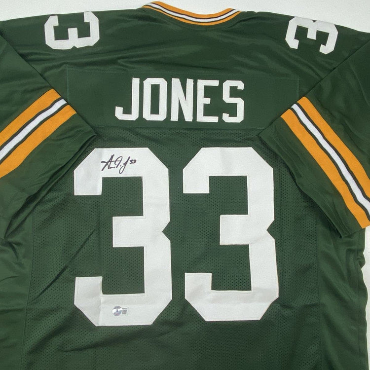 Autographed/Signed Aaron Jones Green Bay Green Football Jersey Beckett BAS COA