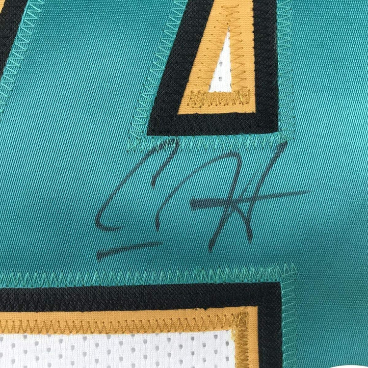 Framed Autographed/Signed Carlos Hyde 33x42 Jacksonville White Football Jersey JSA COA