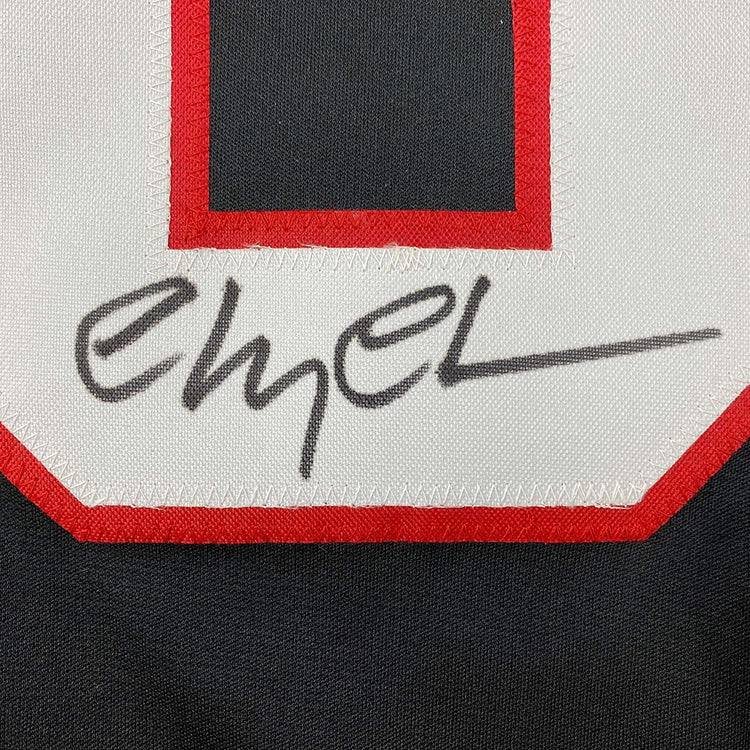 Framed Autographed/Signed Chevy Chase Clark Griswold 35x39 Christmas Vacation Movie Chicago Black Hockey Jersey Beckett BAS COA