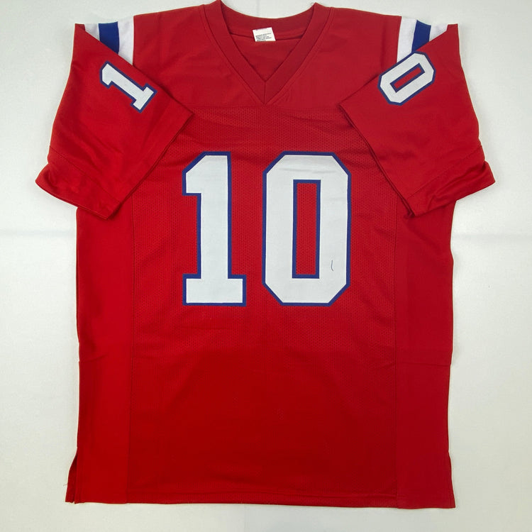 Autographed/Signed Mac Jones New England Red Football Jersey Beckett BAS COA