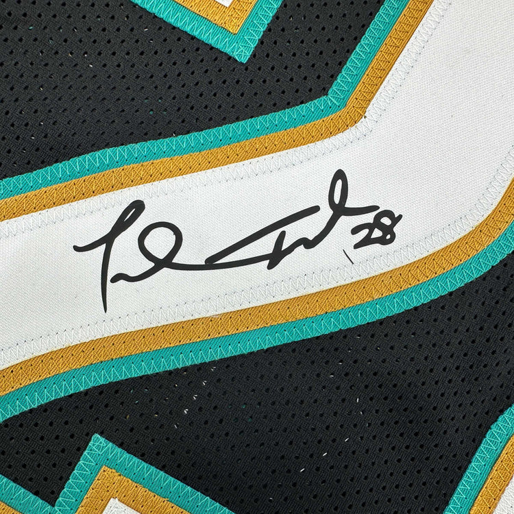 Framed Facsimile Autographed Fred Taylor 35x39 Jacksonville Black Reprint Laser Auto Football Jersey