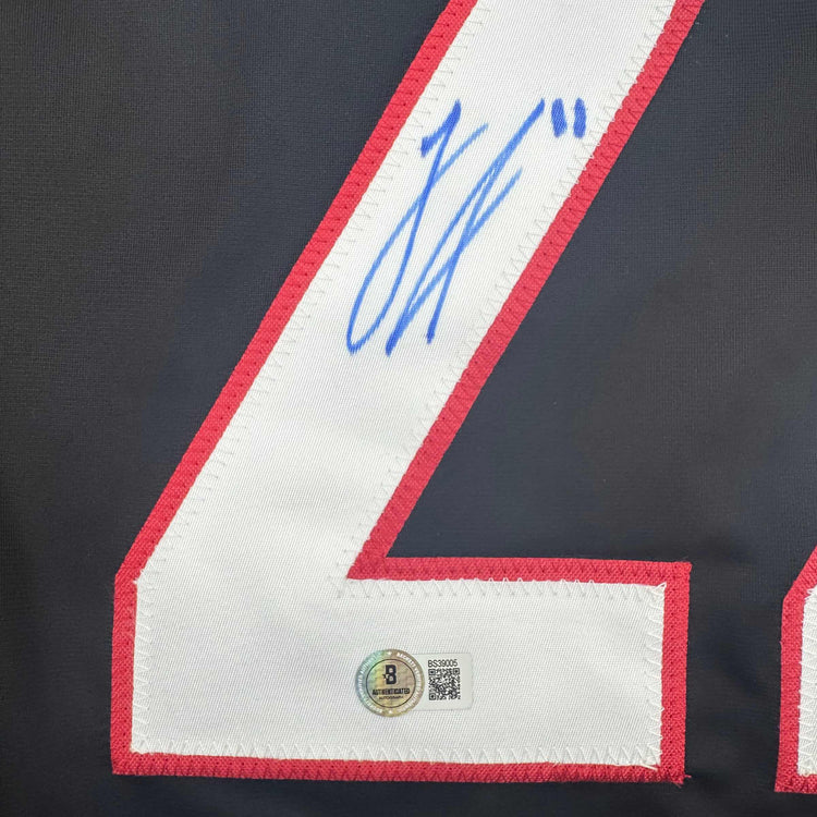 Autographed/Signed Logan Stankoven Carolina Black Hockey Jersey Beckett BAS COA