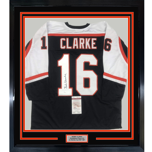 Framed Autographed/Signed Bob Bobby Clarke 35x39 Philadelphia Black Hockey Jersey JSA COA