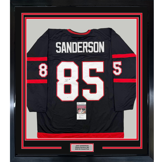 Framed Autographed/Signed Jake Sanderson 35x39 Ottawa Black Hockey Jersey JSA COA