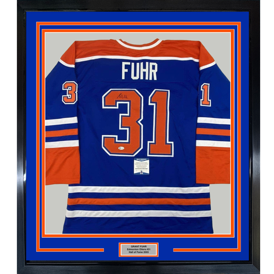Framed Autographed/Signed Grant Fuhr 35x39 Edmonton Blue Hockey Jersey Beckett BAS COA