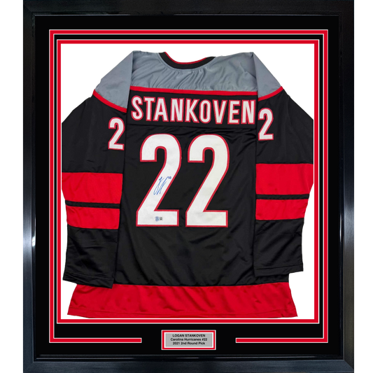 Framed Autographed/Signed Logan Stankoven 35x39 Carolina Black Hockey Jersey Beckett BAS COA