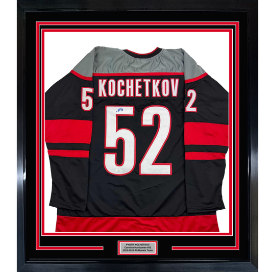 Framed Autographed/Signed Pyotr Kochetkov 35x39 Carolina Black Hockey Jersey JSA COA