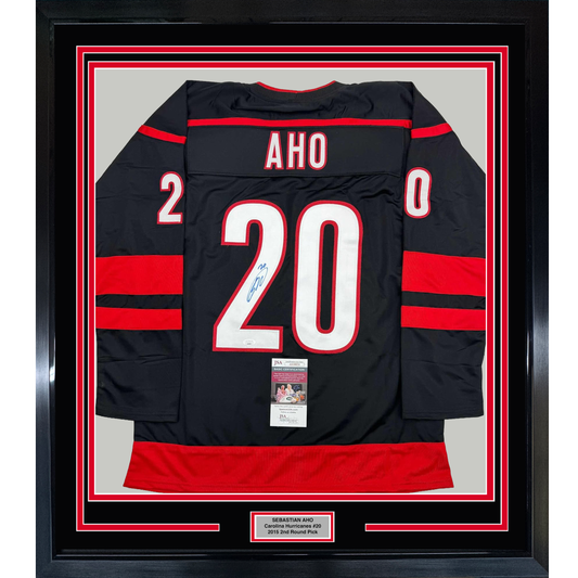 Framed Autographed/Signed Sebastian Aho 35x39 Carolina Black Hockey Jersey JSA COA