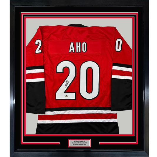 Framed Facsimile Autographed Sebastian Aho 35x39 Carolina Red Reprint Laser Auto Hockey Jersey