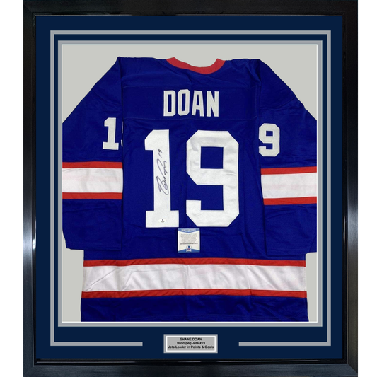 Framed Autographed/Signed Shane Doan 35x39 Winnipeg Blue Hockey Jersey Beckett BAS COA