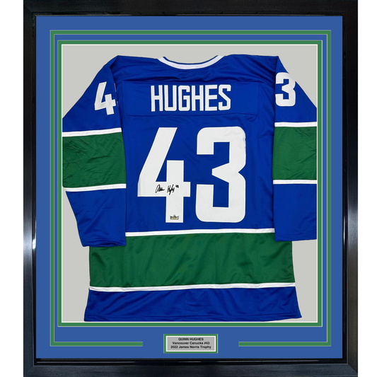 Framed Facsimile Autographed Quinn Hughes 35x39 Vancouver Blue Reprint Laser Auto Hockey Jersey