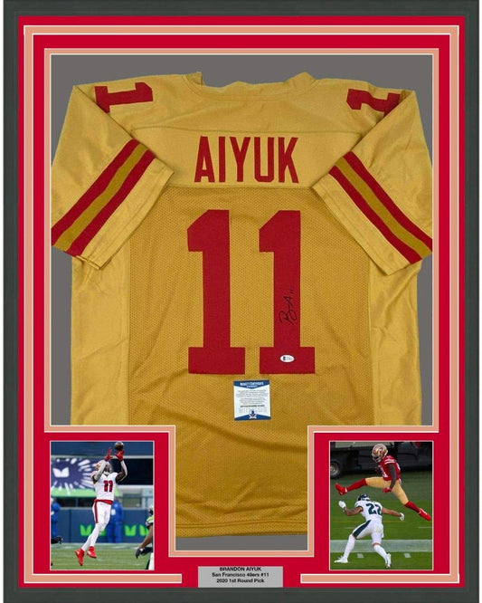 Framed Autographed/Signed Brandon Aiyuk 35x39 San Francisco Gold Football Jersey Beckett BAS COA