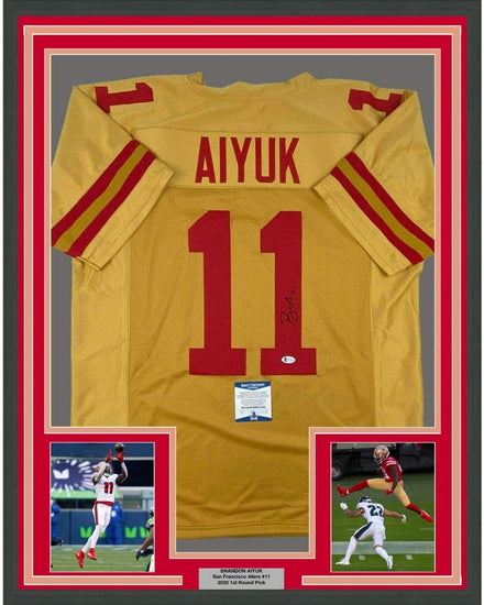 Framed Autographed/Signed Brandon Aiyuk 35x39 San Francisco Gold Football Jersey Beckett BAS COA