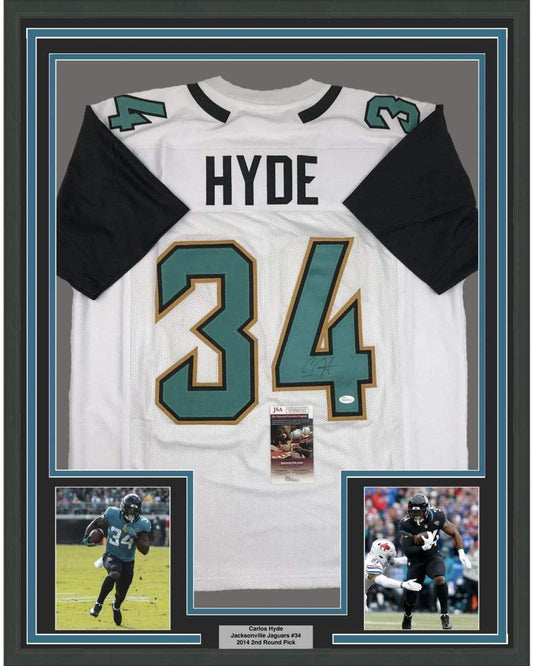 Framed Autographed/Signed Carlos Hyde 35x39 Jacksonville White Football Jersey JSA COA