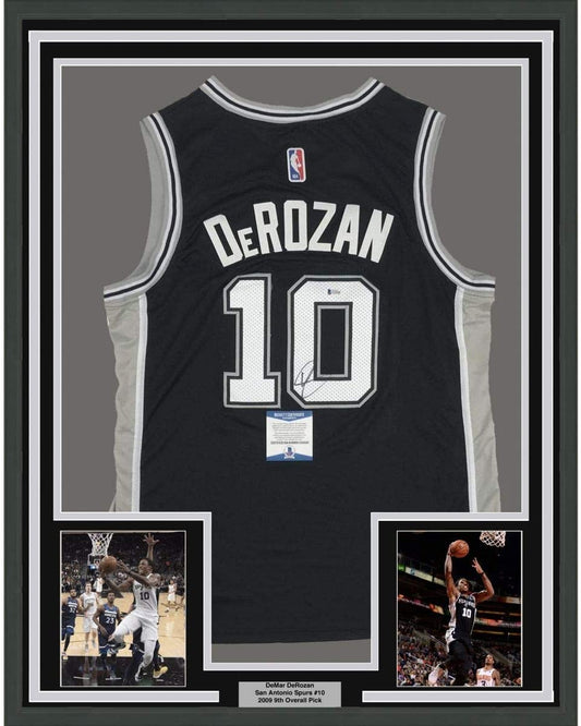 Framed Autographed/Signed DeMar DeRozan 35x39 San Antonio Black Basketball Jersey Beckett BAS COA