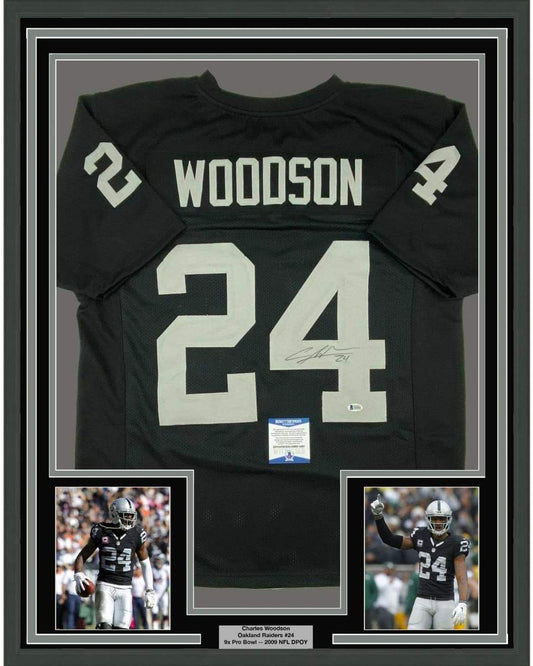 Framed Autographed/Signed Charles Woodson 35x39 Oakland Black Football Jersey Beckett BAS COA